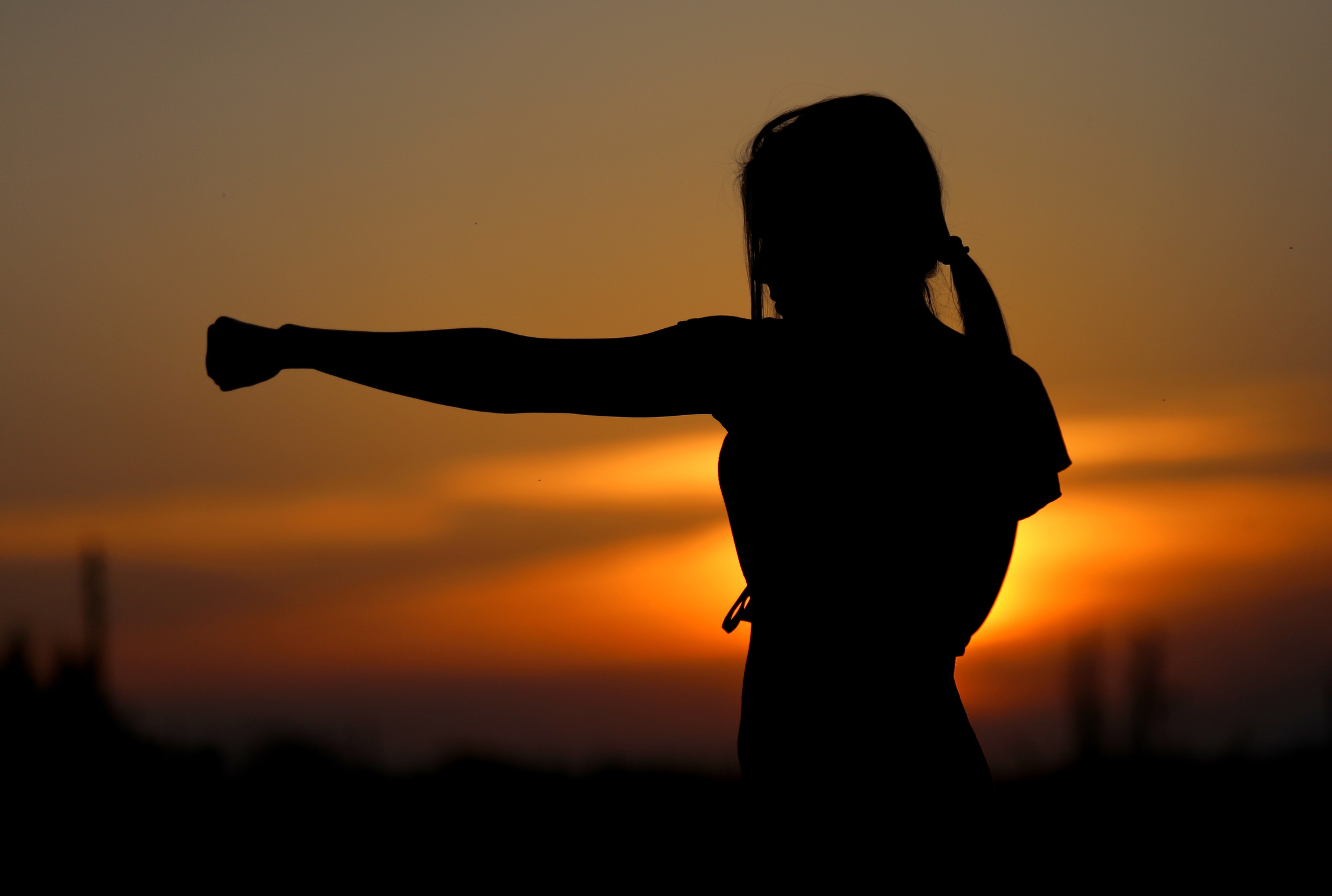 Woman Exercising at Sunset